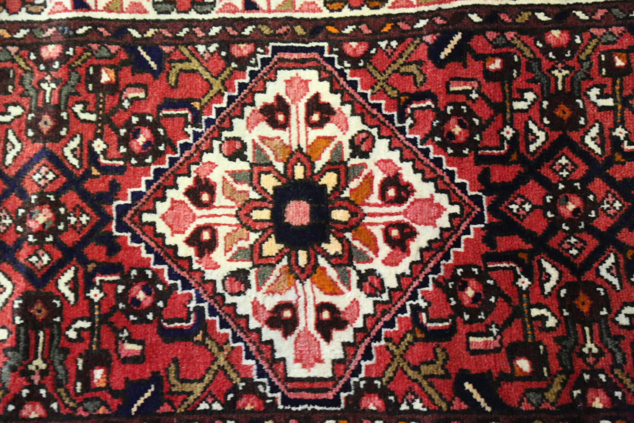 A Malayer runner, North-west Persia, mid/late 20th century, the red field with an overall floral - Image 5 of 9