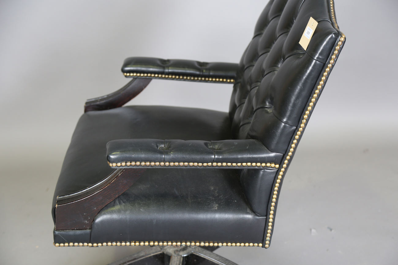 A late 20th century revolving desk chair, upholstered in buttoned black leather, height 95cm, - Image 4 of 11