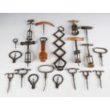 A collection of corkscrews and other collectors' items, including a concertina corkscrew, probably