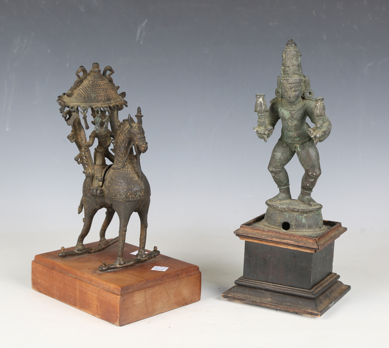 A 19th century Indian bronze model of a figure on horseback, the figure hinged, height 25cm,