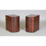 A pair of Regency figured mahogany knife boxes with shaped fronts and ebony line inlaid borders,