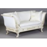 An early 19th century Empire style cream and gilt painted showframe settee, upholstered in white