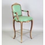 A late 20th century simulated coromandel and gilt painted bar chair, upholstered in green leather,