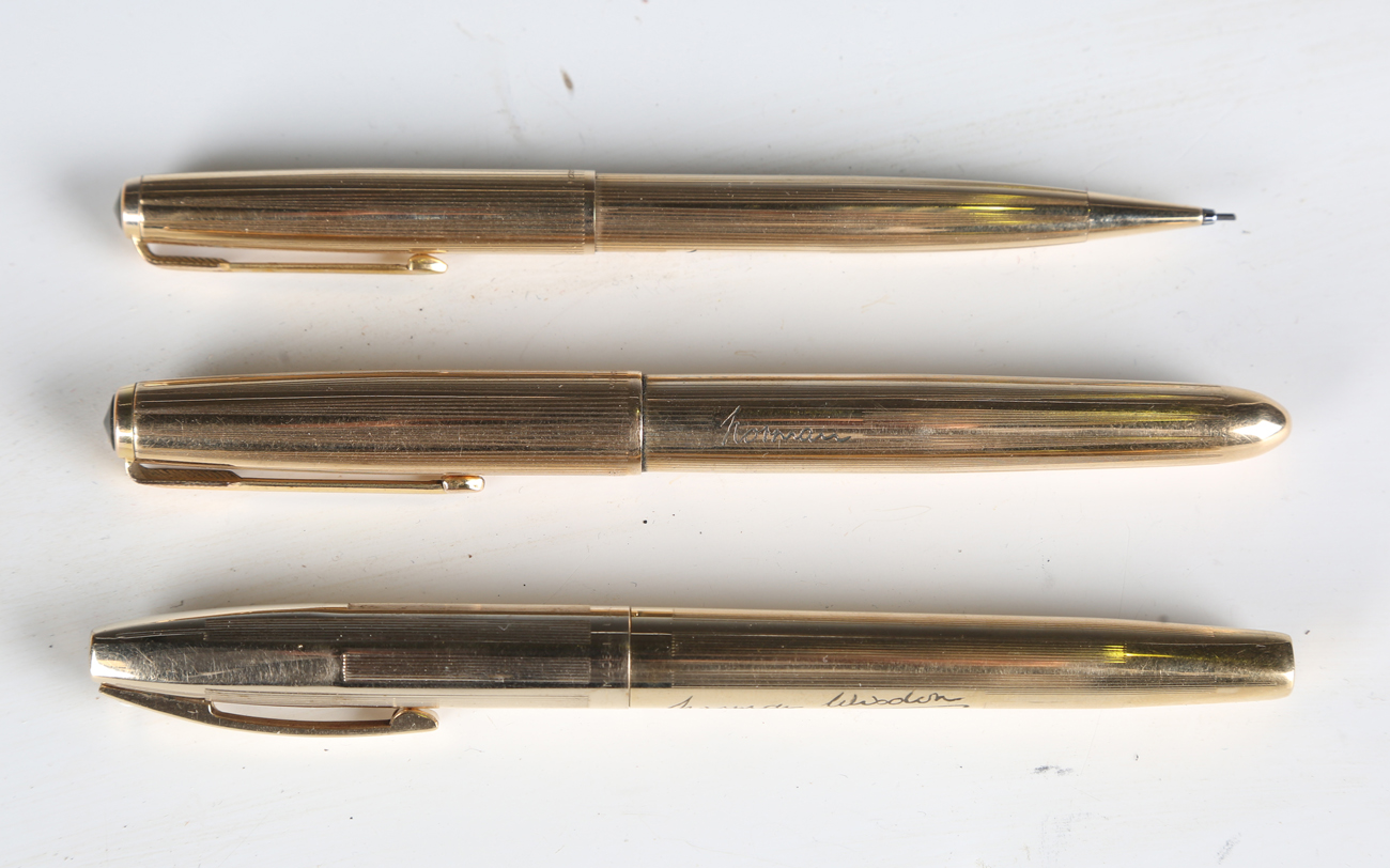 A Parker gold plated fountain pen, the body engraved 'Norman', length 14cm, a Sheaffer gold plated