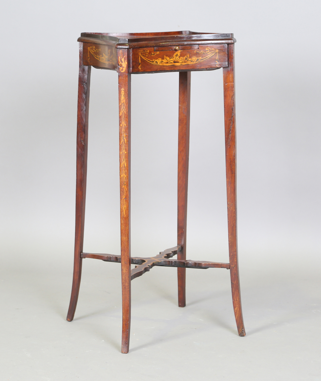 A 19th century Neoclassical Revival mahogany and inlaid kettle stand, the shaped top above a pull-