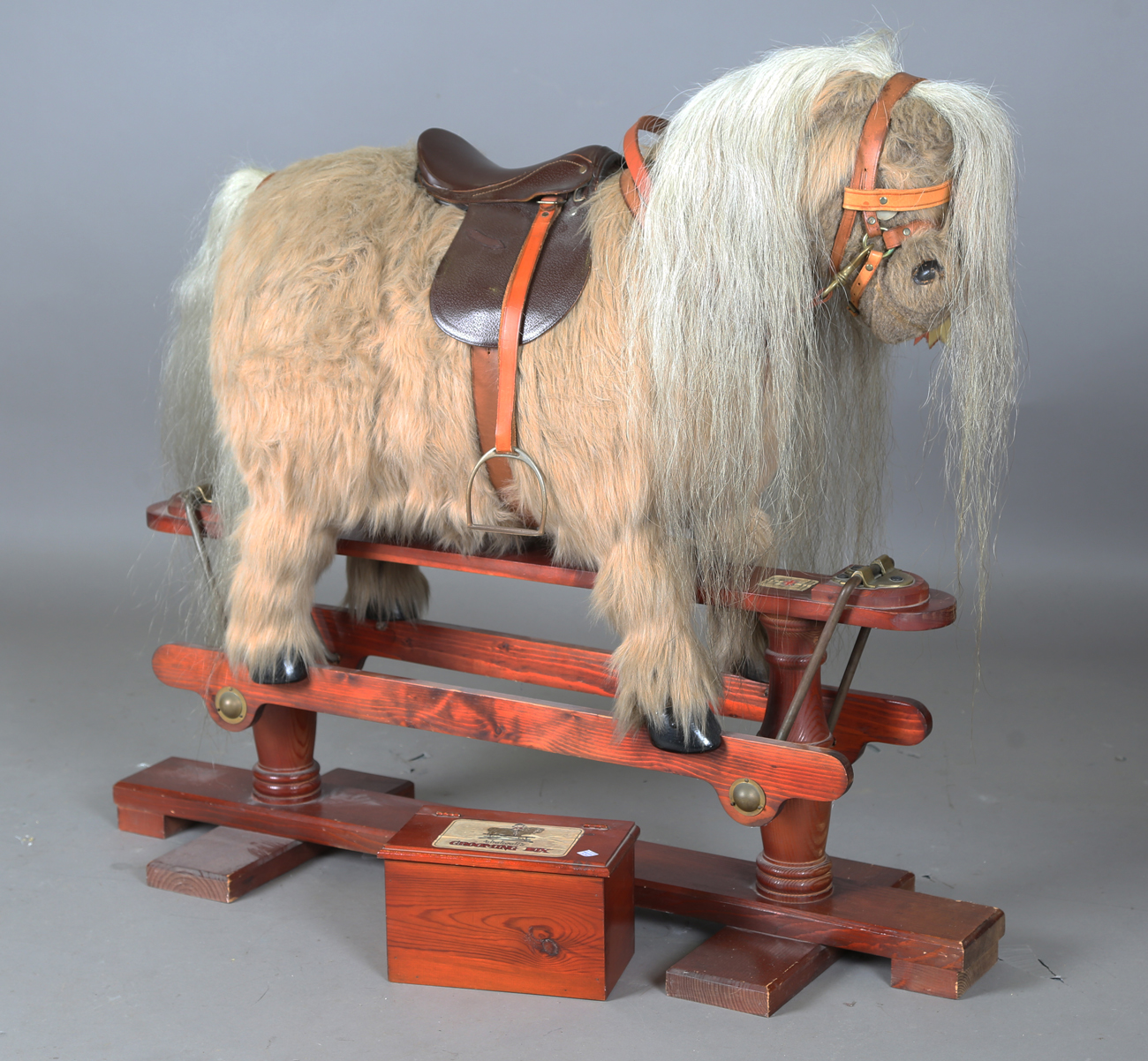 A late 20th century Thelwell pony rocking horse by Kings Horses, the stand bearing maker's label,