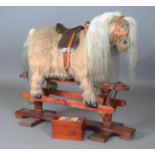 A late 20th century Thelwell pony rocking horse by Kings Horses, the stand bearing maker's label,