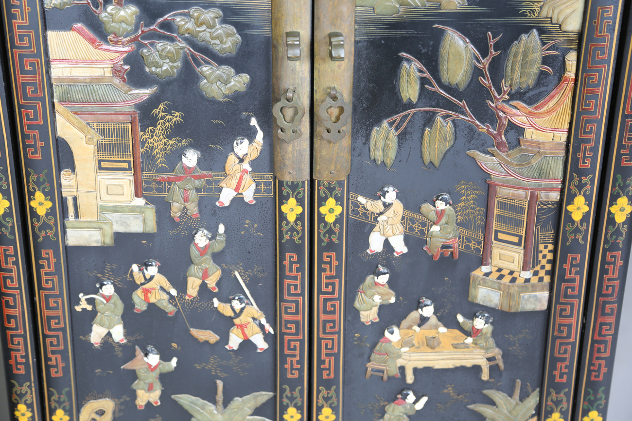 A pair of 20th century Chinese black lacquered and hardstone inlaid side cabinets, each door - Image 16 of 18