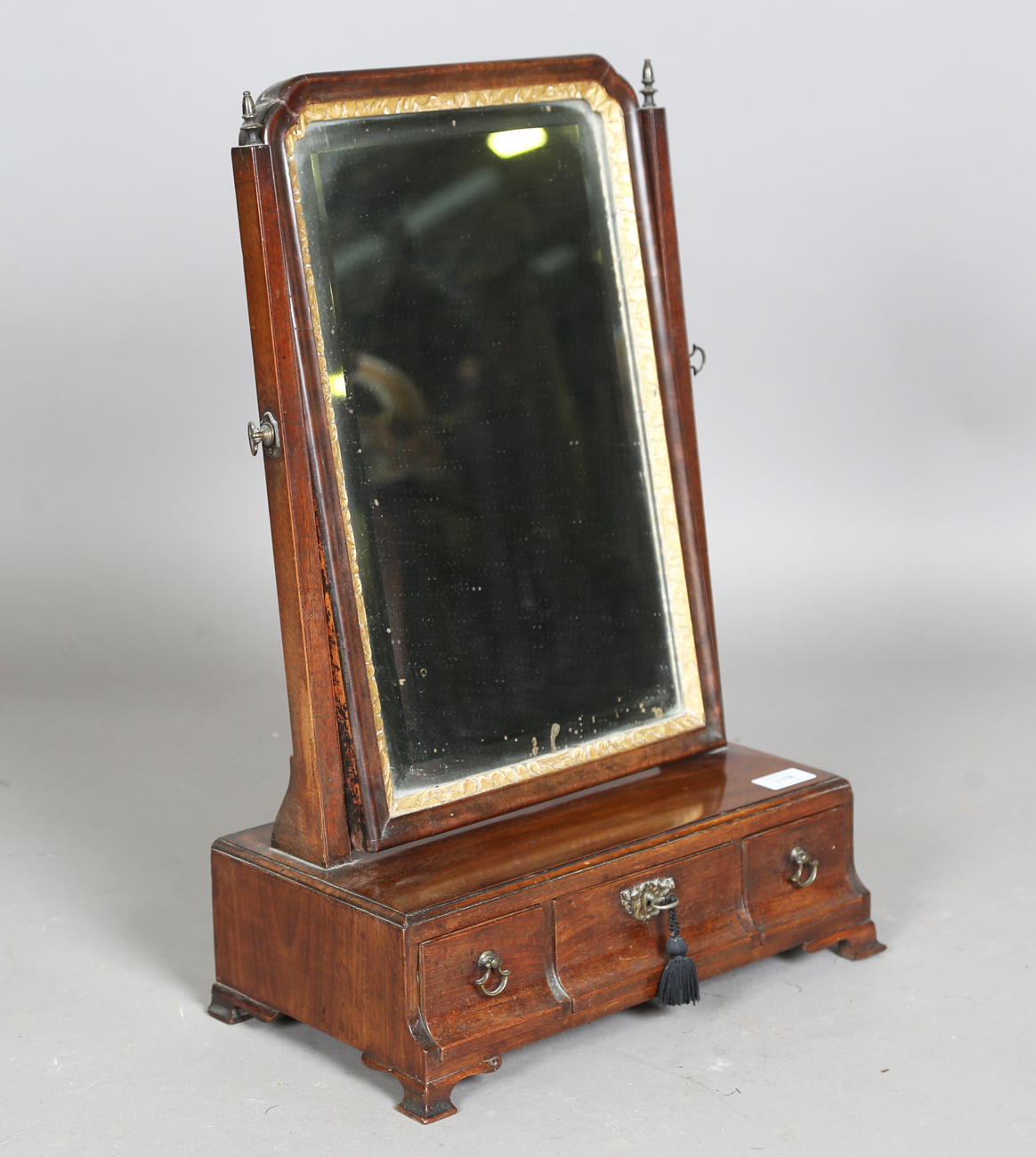 A George II mahogany swing frame mirror, the base fitted with three cedar-lined drawers, height