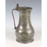 An 18th century Channel Islands pewter flagon, the tappit lid with twin-acorn thumbpiece above a
