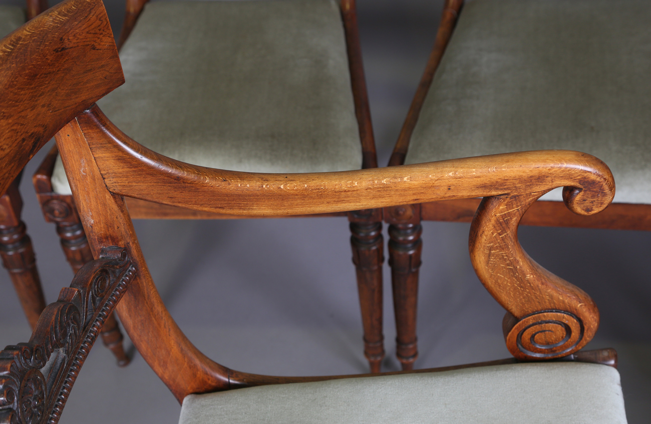 A set of seven Regency simulated rosewood beech framed dining chairs with carved centre rails, - Image 8 of 11