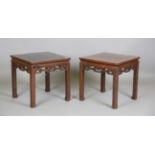 A pair of Chinese hardwood tables, probably Qing dynasty, each square top above a finely carved