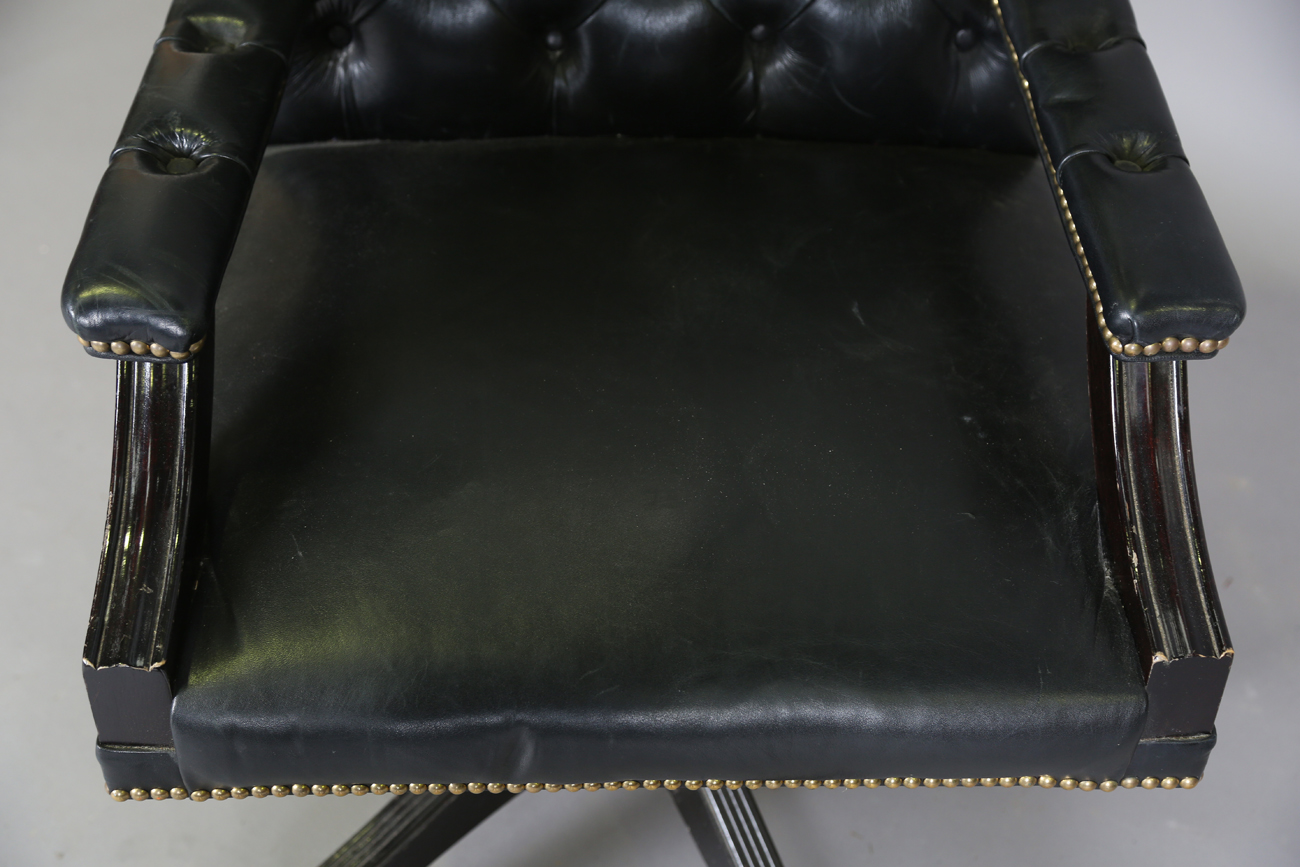 A late 20th century revolving desk chair, upholstered in buttoned black leather, height 95cm, - Image 9 of 11