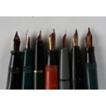 A group of seven fountain pens, comprising Parker Duofold, Parker Slimfold, Conway 67, Parker