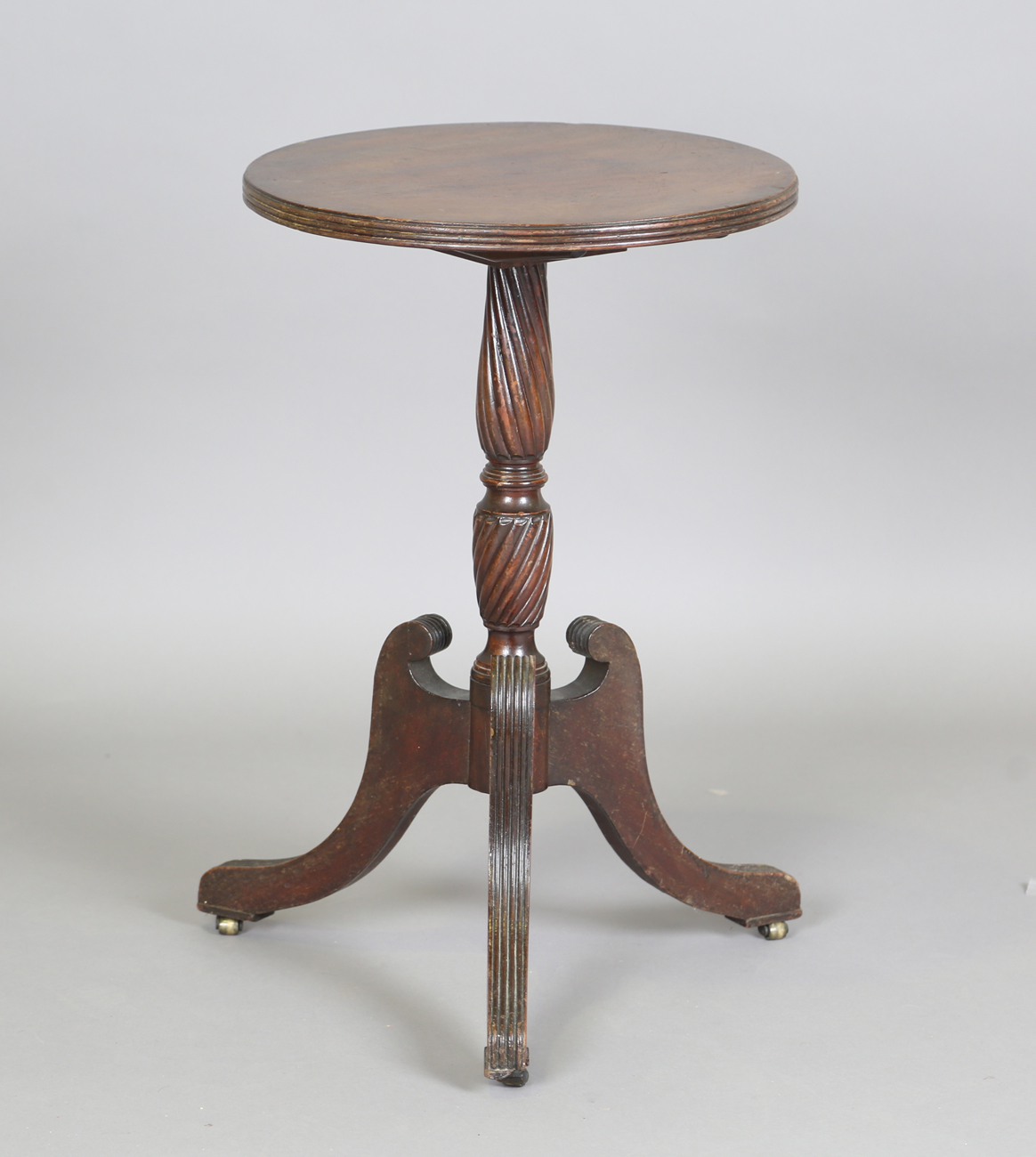 A Regency style mahogany circular tip-top wine table, on tripod legs, height 71cm, diameter 45cm.