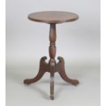 A Regency style mahogany circular tip-top wine table, on tripod legs, height 71cm, diameter 45cm.