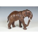A leather model of an elephant, in the manner of Liberty & Co, length 30cm.Buyer’s Premium 29.4% (