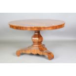 A mid-19th century walnut and foliate inlaid tip-top breakfast table, raised on a triform base,