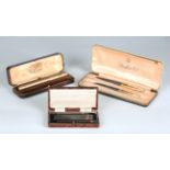 A Waterman's Ideal gold plated fountain pen, in original case, a set of four silver bridge