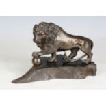 A 19th century patinated spelter model of a Medici lion, raised on a shaped ebony plinth, width