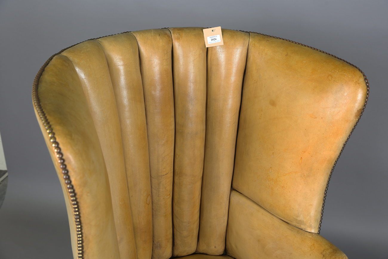 A 20th century George III style armchair, upholstered in studded tan leather, raised on carved - Image 14 of 14
