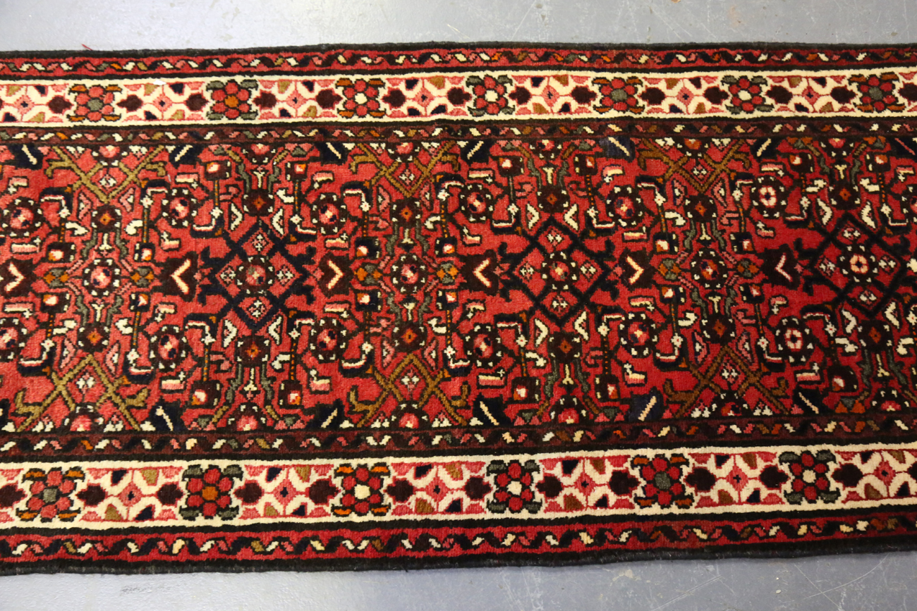 A Malayer runner, North-west Persia, mid/late 20th century, the red field with an overall floral - Image 3 of 9