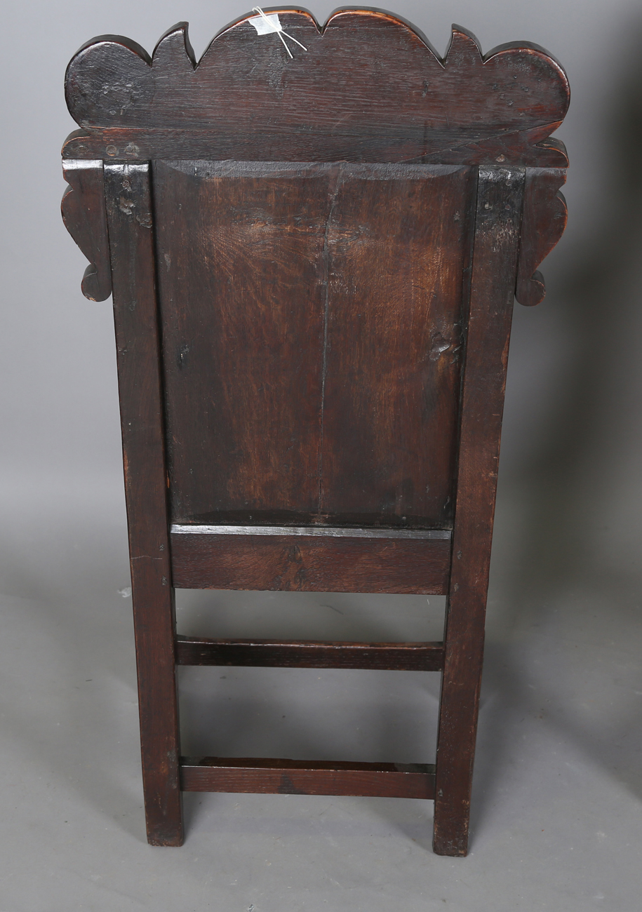 A pair of 17th century provincial oak Wainscot armchairs with carved panel backs and solid panel - Image 11 of 16