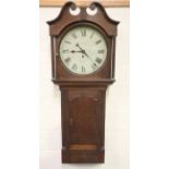 A mid-19th century oak trunk dial wall clock timepiece with weight driven eight day single train