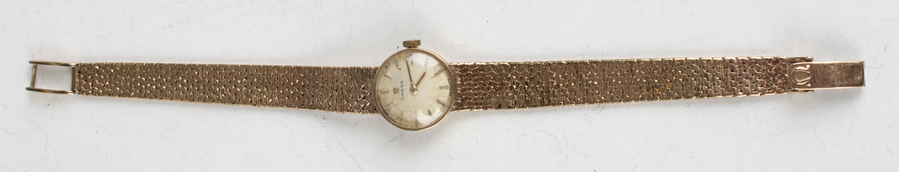 An Omega 9ct gold lady's bracelet wristwatch, the signed circular silvered dial with gilt baton hour - Image 10 of 15