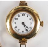 A Peerless 18ct gold circular cased lady's wristwatch with signed jewelled lever movement, 18ct gold
