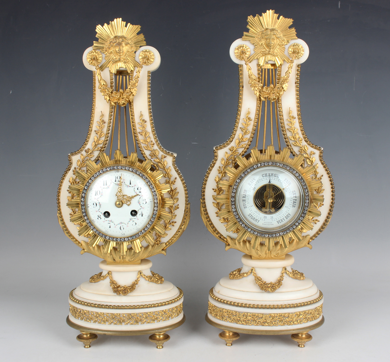 A late 19th century French ormolu mounted white marble Marie Antoinette style mantel clock and