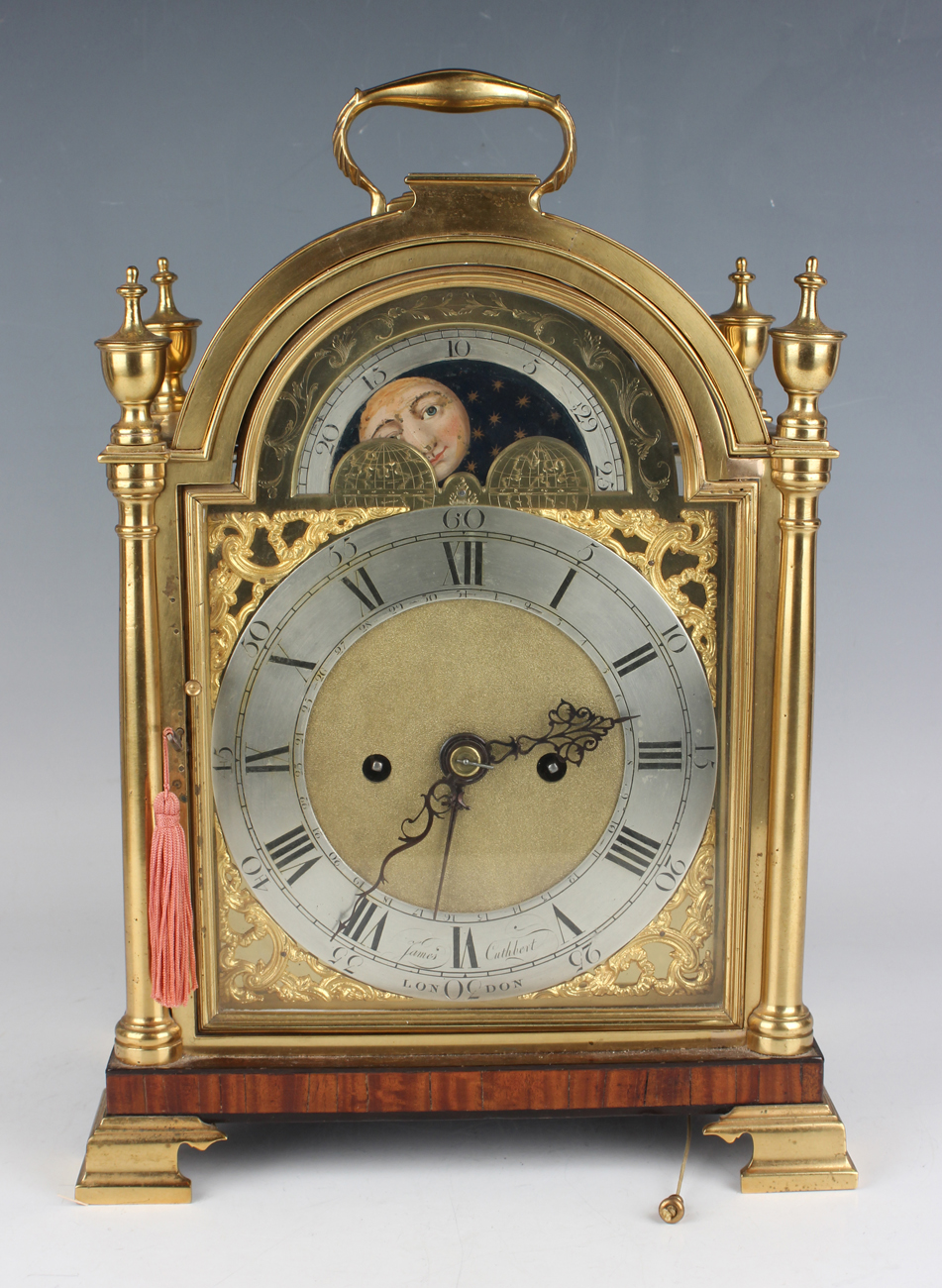 An early 20th century gilt lacquered brass and mahogany cased calendar bracket clock, the brass four