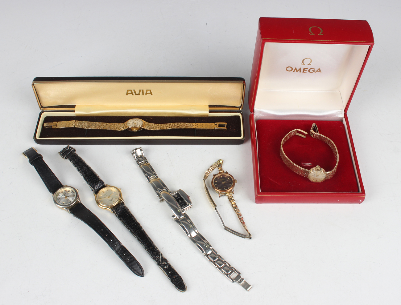An Omega 9ct gold lady's bracelet wristwatch, the signed circular silvered dial with gilt baton hour
