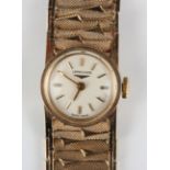 A Longines 9ct gold lady's bracelet wristwatch, the signed circular dial with gilt baton hour