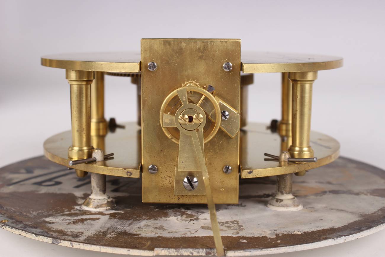 An early 20th century brass circular cased ship's bulkhead type timepiece, the brass four pillar - Image 6 of 9