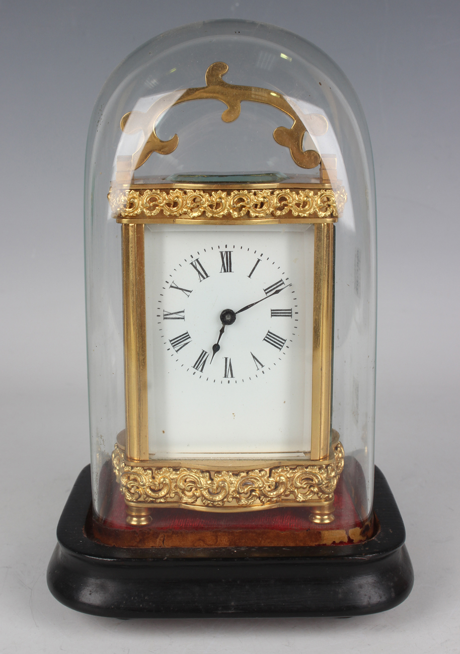 A late 19th/early 20th century French lacquered brass carriage timepiece with eight day movement,