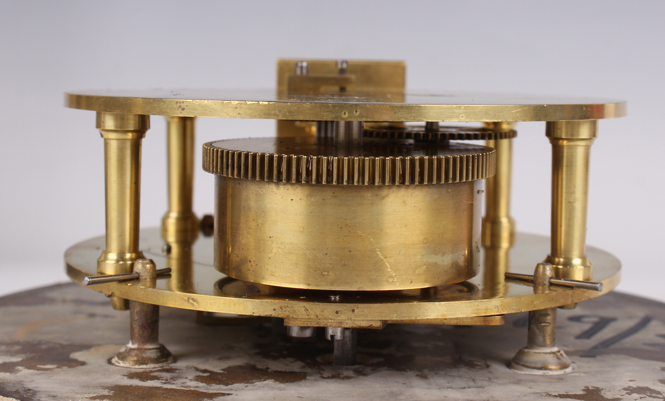 An early 20th century brass circular cased ship's bulkhead type timepiece, the brass four pillar - Image 5 of 9