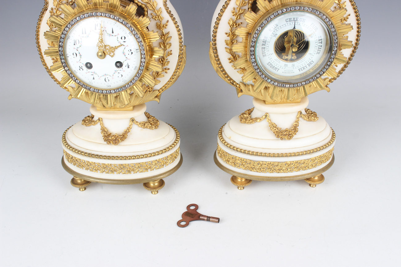 A late 19th century French ormolu mounted white marble Marie Antoinette style mantel clock and - Image 2 of 12