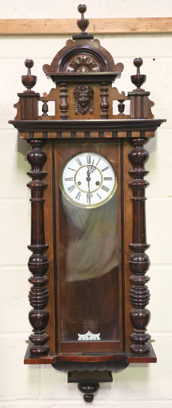 A late 19th century walnut cased Vienna style wall clock by Gustav Becker, height 124cm, together