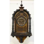 A mid to late 19th century Black Forest oak and ebonized cuckoo wall clock with eight day twin fusee