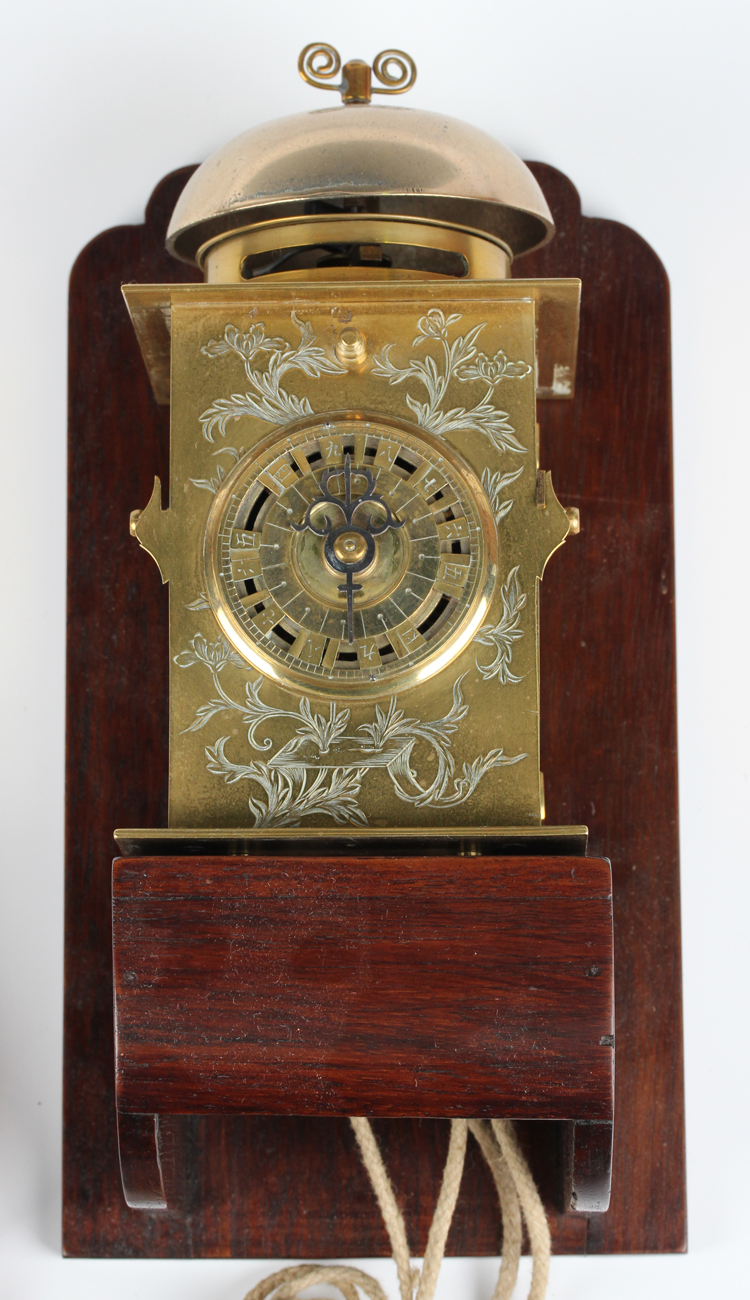 A mid to late 19th century Japanese engraved brass kake-dokei lantern timepiece with alarm, the