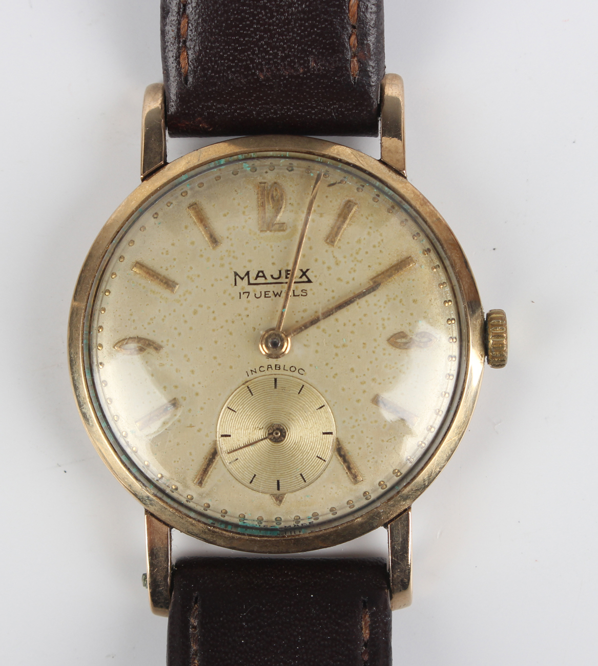 A Majex 9ct gold circular cased three-quarter size wristwatch, the signed silvered dial with gilt