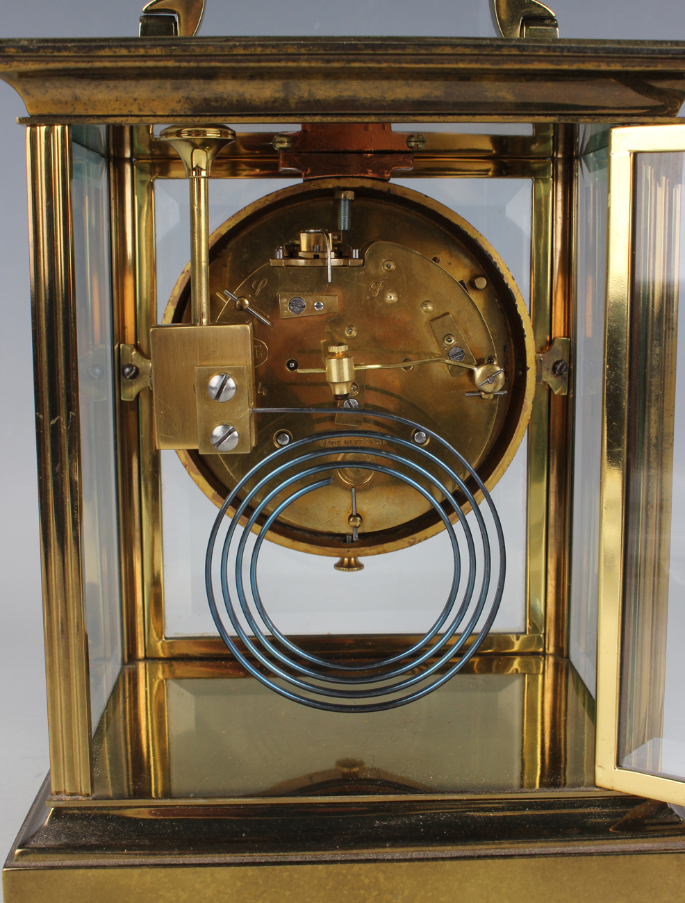 A 20th century French lacquered brass four glass mantel clock, the eight day movement with - Image 7 of 8
