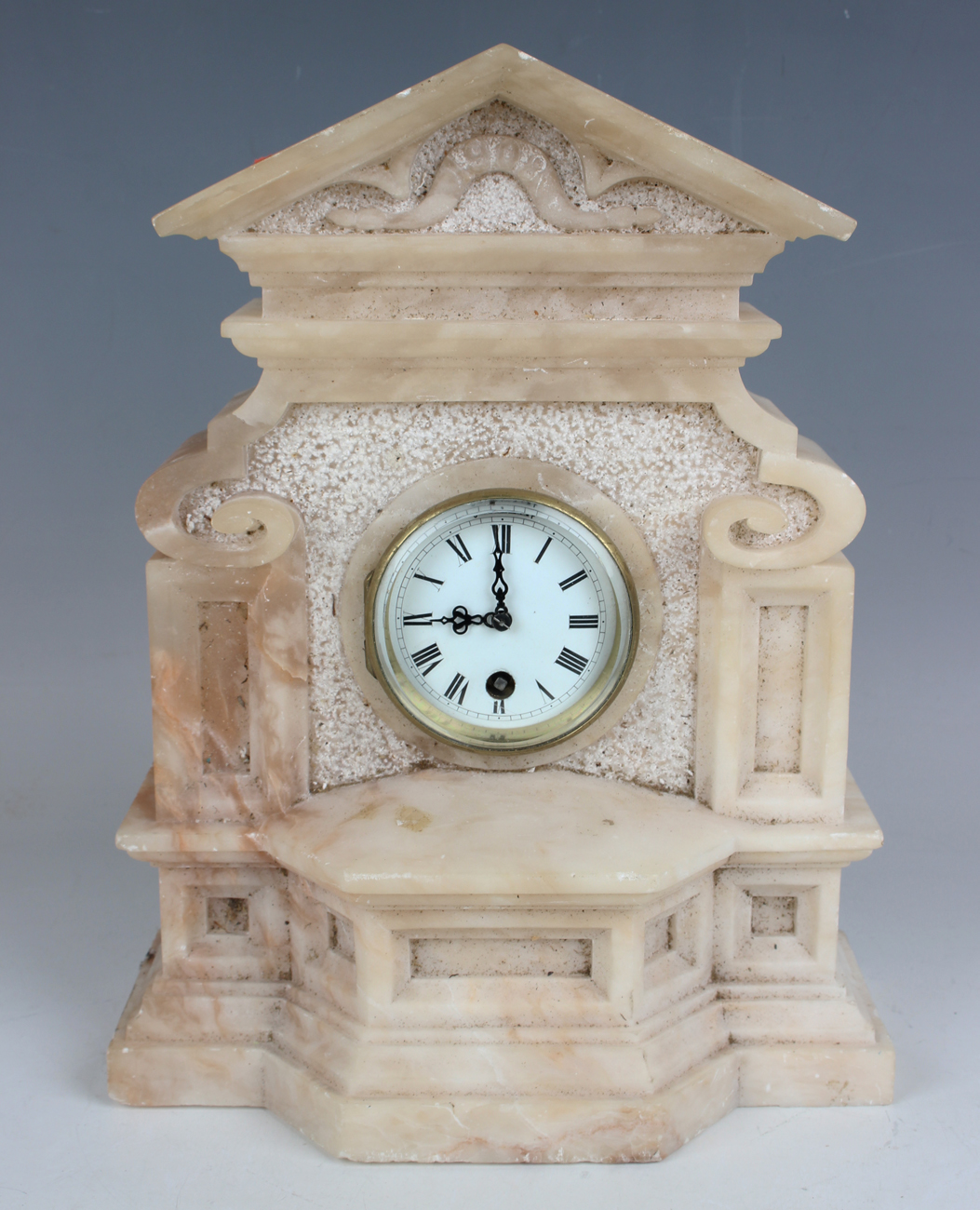 A late 19th century alabaster cased mantel timepiece, the movement with platform escapement, the