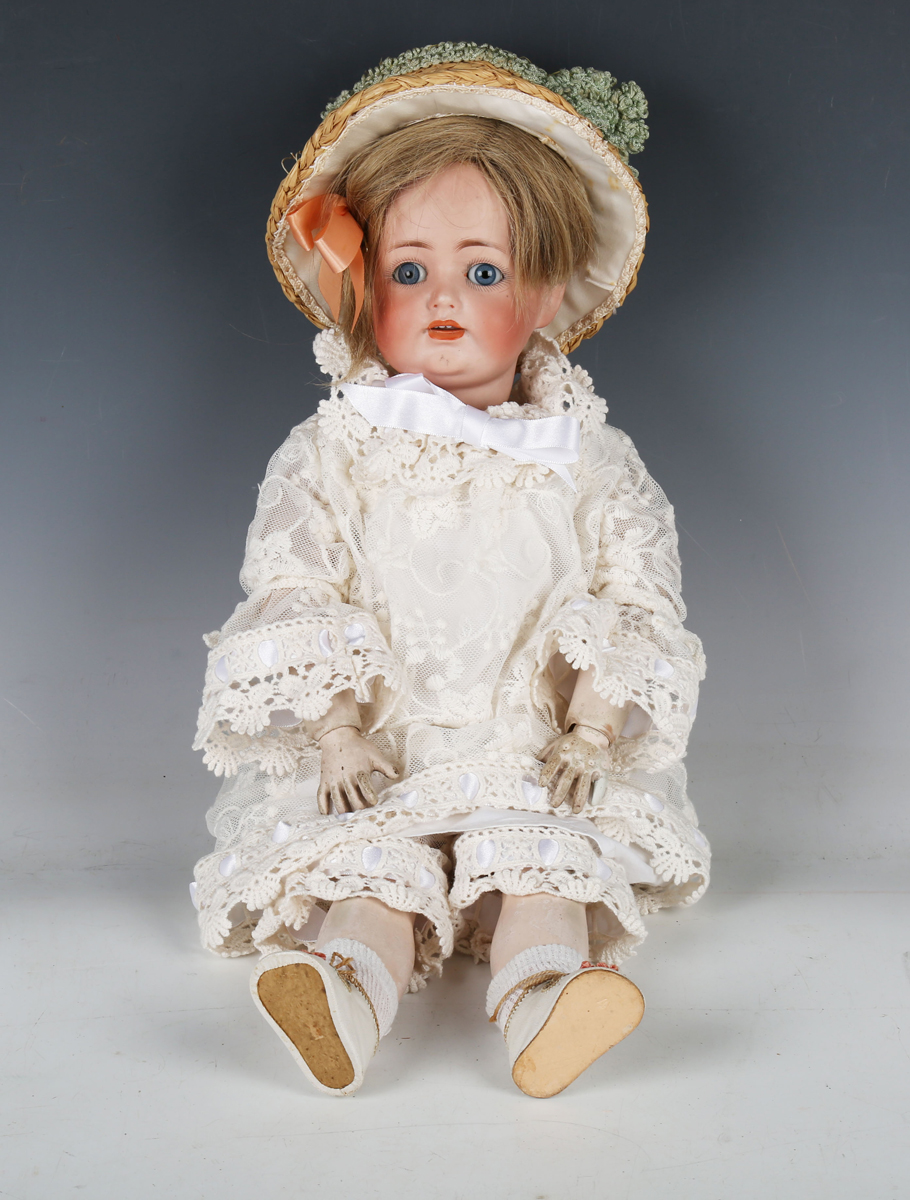 A J.D. Kestner bisque head doll, impressed '260 43', with later wig, open mouth showing upper