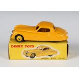 A Dinky Toys No. 157 Jaguar XK120 coupé in yellow with yellow wheels, boxed with correct colour spot