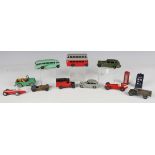 A collection of Dinky Toys vehicles and accessories, including No. 39A Packard in green, No. 40B