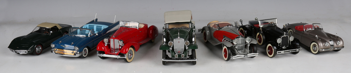 Thirteen Franklin Mint and Danbury Mint 1:24 and 1:43 scale model cars, including Jaguar SS-100,
