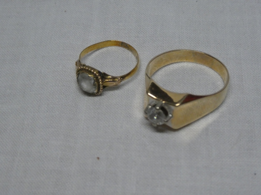 Two various unmarked gold dress rings set clear stones
