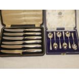 A set of six silver coffee spoons by Mappin and Webb in fitted case and a set of six stainless tea